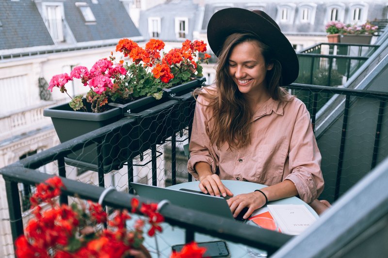woman-wearing-beige-dress-shirt-using-laptop-computer